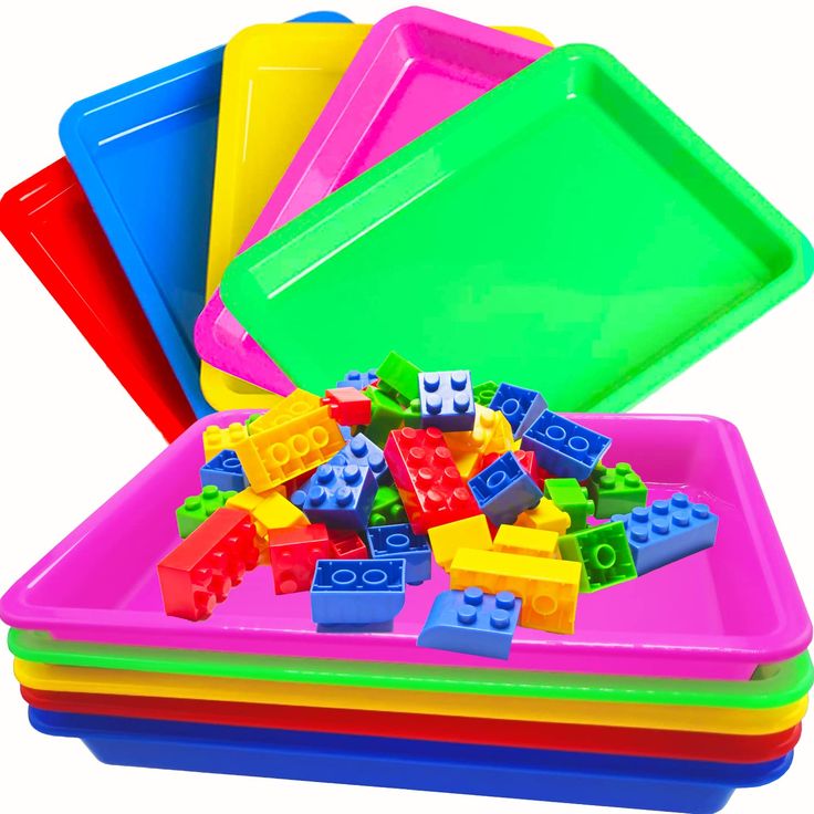 legos are stacked on top of each other in different colors and shapes to be played with