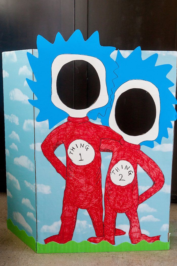 a cardboard box made to look like two people standing next to each other with their hands on their hips