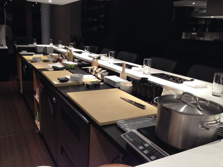 a kitchen filled with lots of counter top space and cooking utensils on the counters