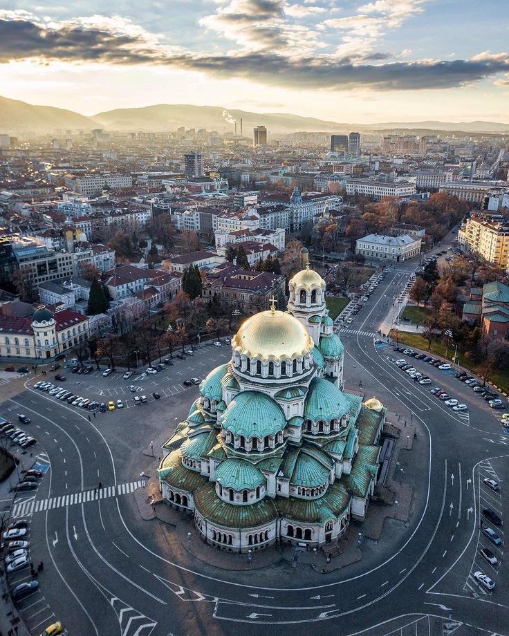 an aerial view of a large building in the middle of a city