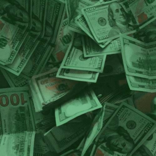 a pile of twenty dollar bills sitting on top of each other in front of a green background