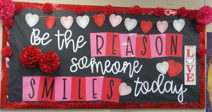 a bulletin board that says be the reason someone smiles today with hearts and flowers on it