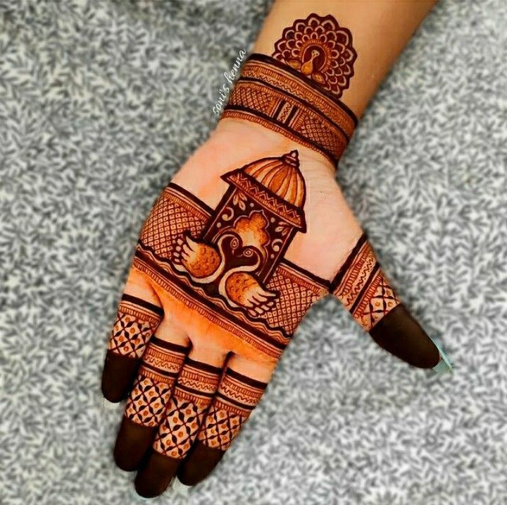 hendi design on the palm of someone's hand