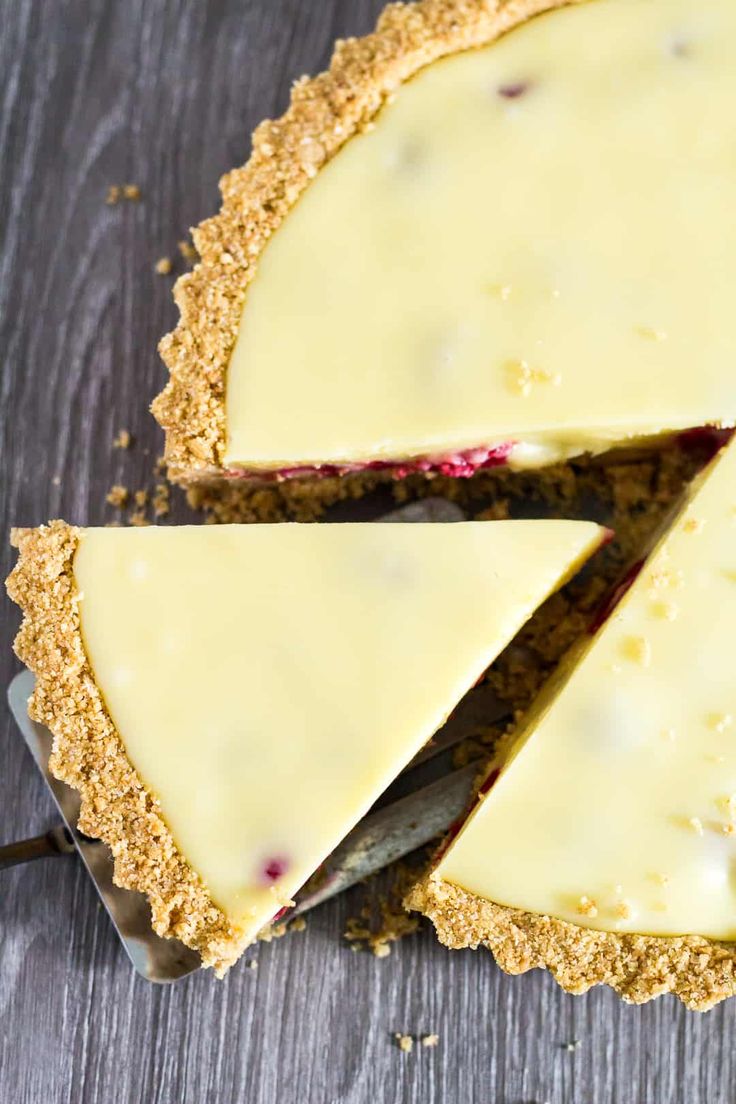 a cheesecake is cut into slices on a table