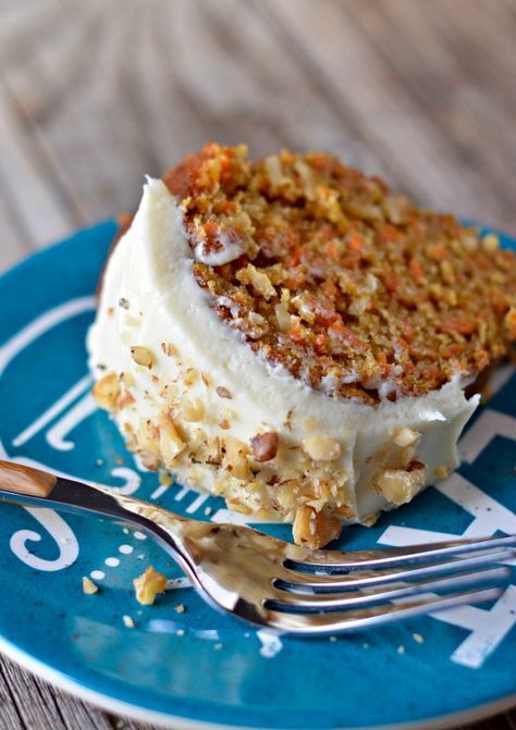 a piece of cake on a blue plate with a fork