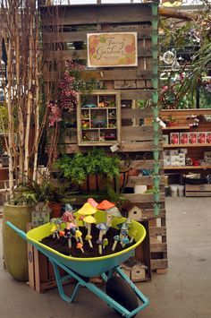 a wheelbarrow filled with dirt and small figurines