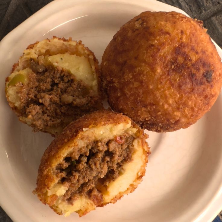 three different types of food on a white plate