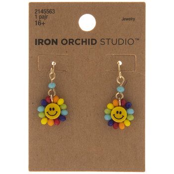 Stay positive with these Beaded Smiley Face Earrings as a part of your outfit! These hook-style earrings boast faceted, colorful beads around smiley face centers. The beads look like colorful petals, making the smiley faces resemble flowers! Slip these on with a colorful outfit for a look that will uplift your spirit. Details: 	 Length: 1 1/16" 	 Width: 1/2" 	 Metal Color: Gold Card contains 1 pair of earrings. Fun Summer Jewelry With Smiley Face, Fun Smiley Face Jewelry For Summer, Fun Smiley Face Summer Jewelry, Playful Multicolor Beaded Earrings, Cheerful Multicolor Smiley Face Jewelry, Fun Multicolor Flower Earrings, Beaded Smiley Face, Smiley Face Earrings, Retro Clothes