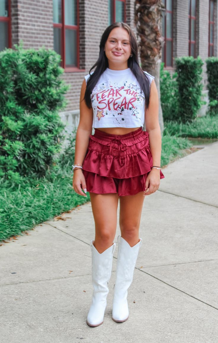 Fear the Spear! Show off your game day spirit with The Fear the Spear Cap Sleeve Crop. This cropped tee features a bold graffiti style graphic and cap sleeves for a modern take on fan gear. Perfect for pairing with your favorite skirt, get ready to cheer on the Seminoles in style! Details: *OFFICALLY LICENSED* Super Soft, & Stretchy Knit Tee 100% Cotton Crew Neckline, Cap Sleeve, Cropped Length Features Fear the Spear Graphic on Center Chest Color: White True to Size: Relaxed fit Julia is wearin Casual Summer Game Day Crop Top, Casual Summer Crop Top For Game Day, Summer Casual Cheerleading Crop Top, Casual Summer Crop Top For Cheerleading, Summer Casual Crop Top For Cheerleading, Tallahassee Florida, Fashion Bottoms, Florida State University, Florida State Seminoles