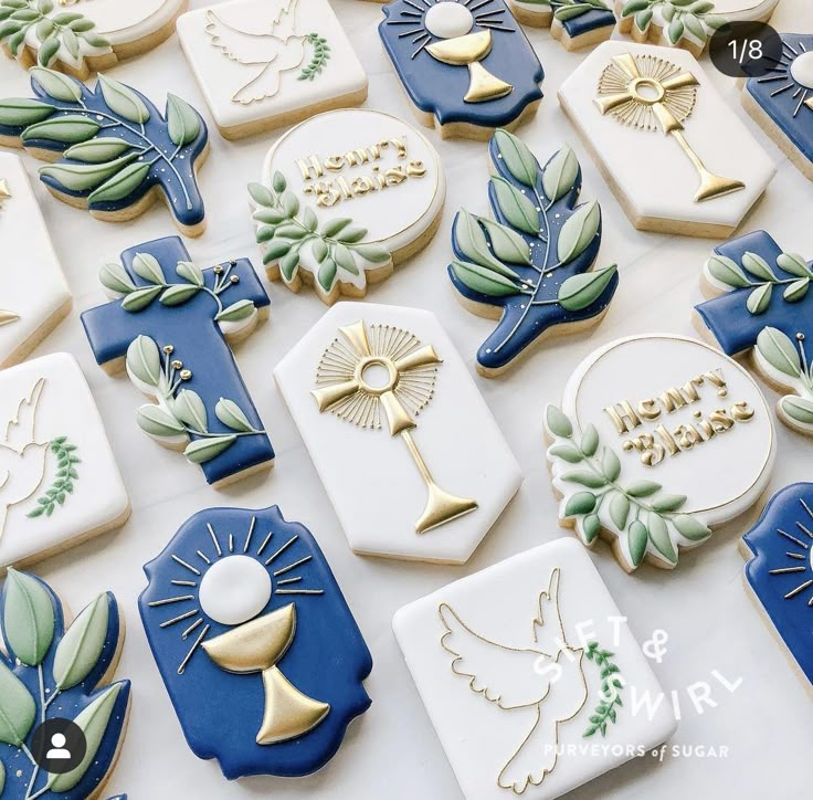 many decorated cookies are displayed on a table