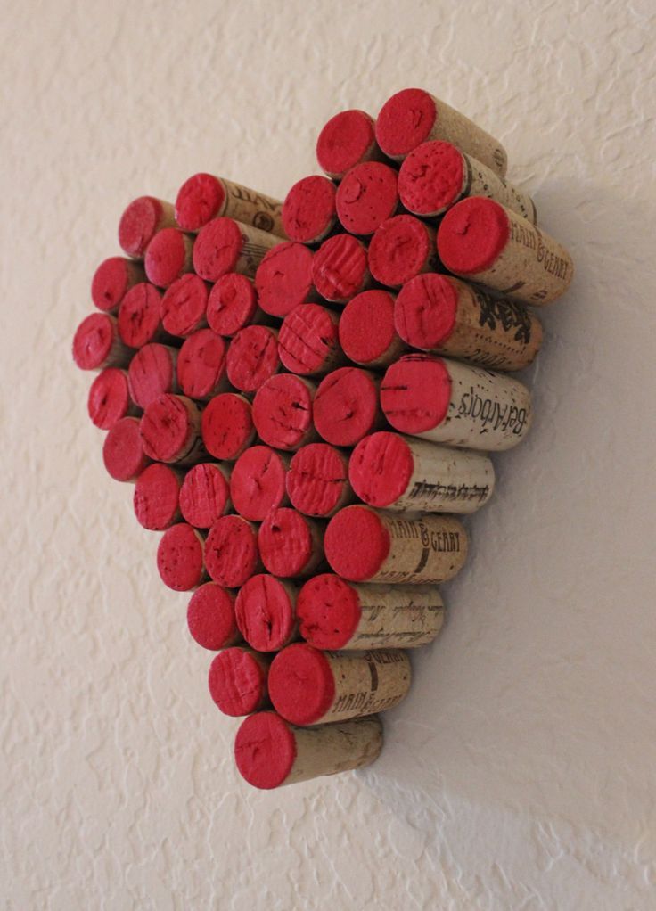 a heart made out of wine corks on a wall