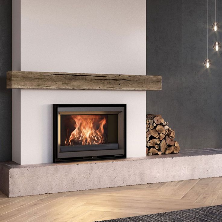 a wood burning fireplace in a living room