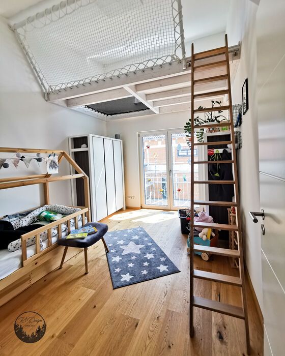 a bedroom with bunk beds and ladders in it