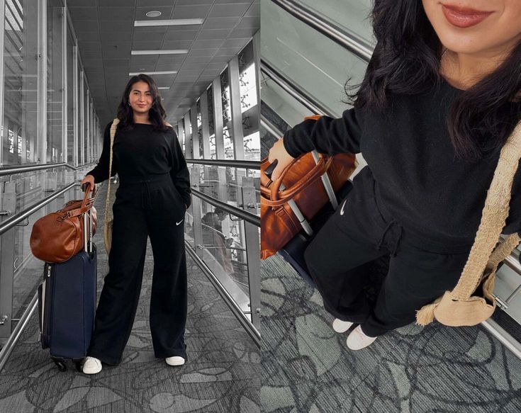 a woman is standing on an escalator with her hand in her pockets and holding two suitcases