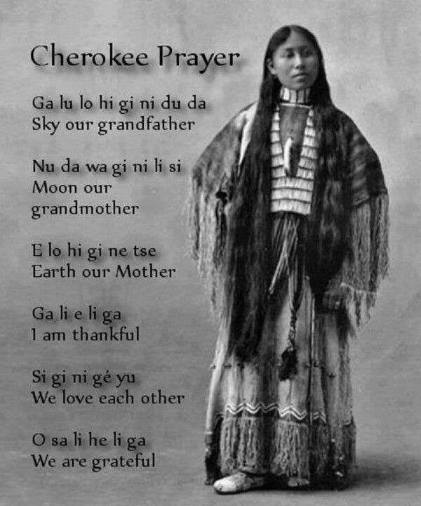 an native american woman standing in front of a poem