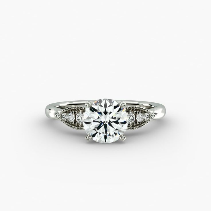 a diamond engagement ring on a white background