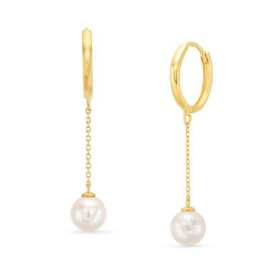 Each earring features a lustrous freshwater pearl. The delicate chain drop adds a contemporary and trendy twist to the classic huggie earring style. Minimalist Long Drop Earrings With Pearl Charm, Elegant Hoop Earrings With Adjustable Chain As Gift, Elegant Gold Huggie Earrings With Pearl Charm, Elegant Adjustable Chain Hoop Earrings As Gift, Elegant Sterling Silver Hoop Earrings With Adjustable Chain, Formal Yellow Gold Huggie Earrings With Pearl Drop, Dainty Pearl Charm Dangle Huggie Earrings, Classic Dangle Hoop Earrings With Pearl Charm, Minimalist Teardrop Pearl Chain Earrings