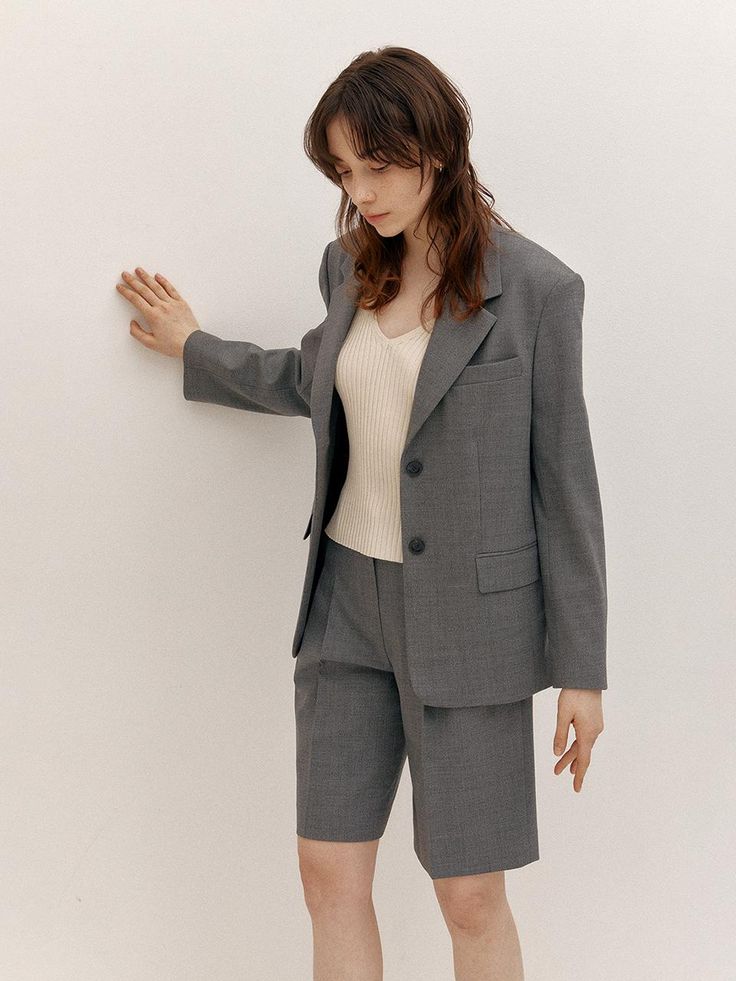 This is AVA MOLLI’s classic tailored jacket with a basic design. Designed with a semi-oversized fit, it creates a slight waistline when worn, making it a charming jacket that combines mannishness and femininity. It's designed to feel light and fresh when worn. This jacket stands out with delicate and comfortable wearability, as well as the soft slub texture that adds a natural charm.- It's a great item for daily wear- It can be paired with various styles of outfits to create different looks- The buttons on the front can be unfastened for versatility- The pockets on the front add practicality Gray Single Breasted Blazer With Suit Collar, Gray Single-breasted Blazer With Suit Collar, Spring Gray Suits For Workwear, Spring Gray Suit For Work, Spring Gray Workwear Suits, Gray Notch Lapel Outerwear For Office, Gray Single Breasted Blazer With Notch Lapel, Gray Notch Lapel Blazer For Spring, Spring Gray Notch Lapel Blazer