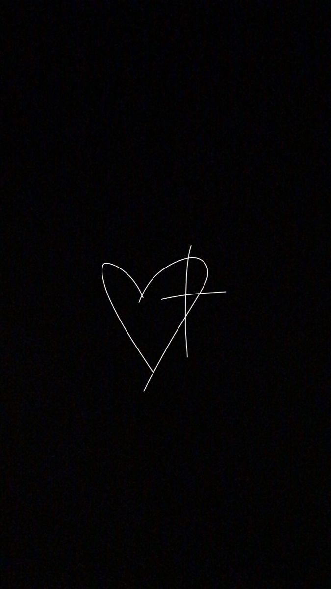 an airplane is flying in the dark with a heart drawn on it