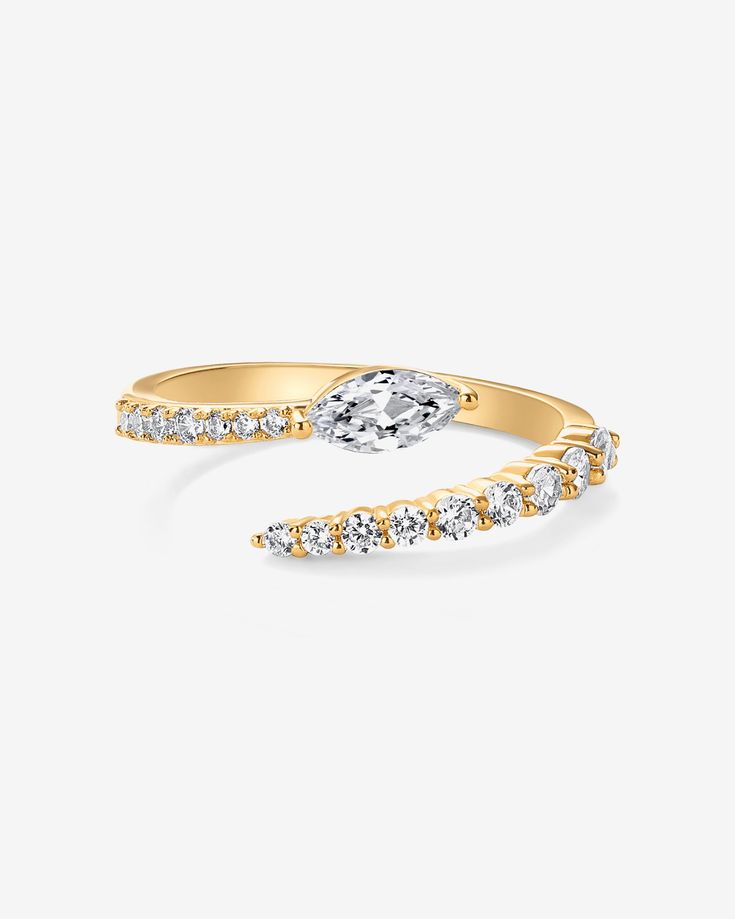 Step up your style game with our captivating open twist gold ring. Featuring a striking marquise stone as its centerpiece, surrounded by an array of shimmering AAAAA CZ stones, this ring exudes elegance and sophistication. Whether you're dressing up for a special occasion or adding a touch of glam to your everyday look, this versatile piece is sure to turn heads.Materials: 14K Yellow Gold or Rhodium plated AAAAA Cubic Zirconia Ring Sizes: #5, #6, #7, #8, #9.. Hypoallergenic; nickel, cadmium, and Twisted Gold Ring, Crossover Ring, Cubic Zirconia Rings, Ring Sizes, White Ring, Cz Stone, Everyday Jewelry, Yellow Gold Rings, White Gold Rings