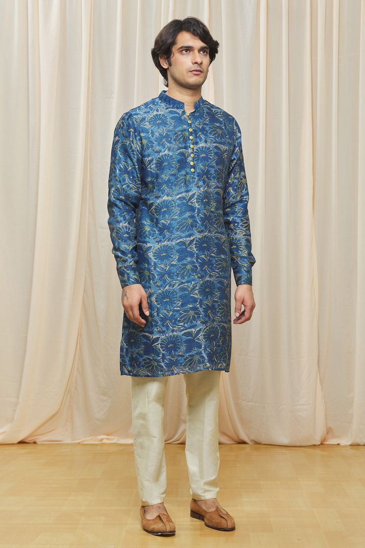 Indigo blue kurta with floral printed motifs and mandarin collar.
Component: 1
Pattern: Printed
Type Of Work: Floral
Neckline: Mandarin
Sleeve Type: Cuff Sleeves
Fabric: Chanderi
Color: Blue
Other Details: 
Floral print
Note: Pant worn by the model is not for sale
Occasion: Puja, Wedding - Aza Fashions Blue Floral Print Traditional Wear For Festive Occasions, Festive Long Sleeve Kurta With Paisley Print, Long Sleeve Paisley Print Kurta For Festive Occasions, Formal Blue Sets With Printed Motifs, Blue Formal Sets With Printed Motifs, Festive Long Sleeve Paisley Print Kurta, Blue Printed Straight Kurta, Blue Traditional Printed Sets, Fitted Blue Traditional Wear With Floral Print