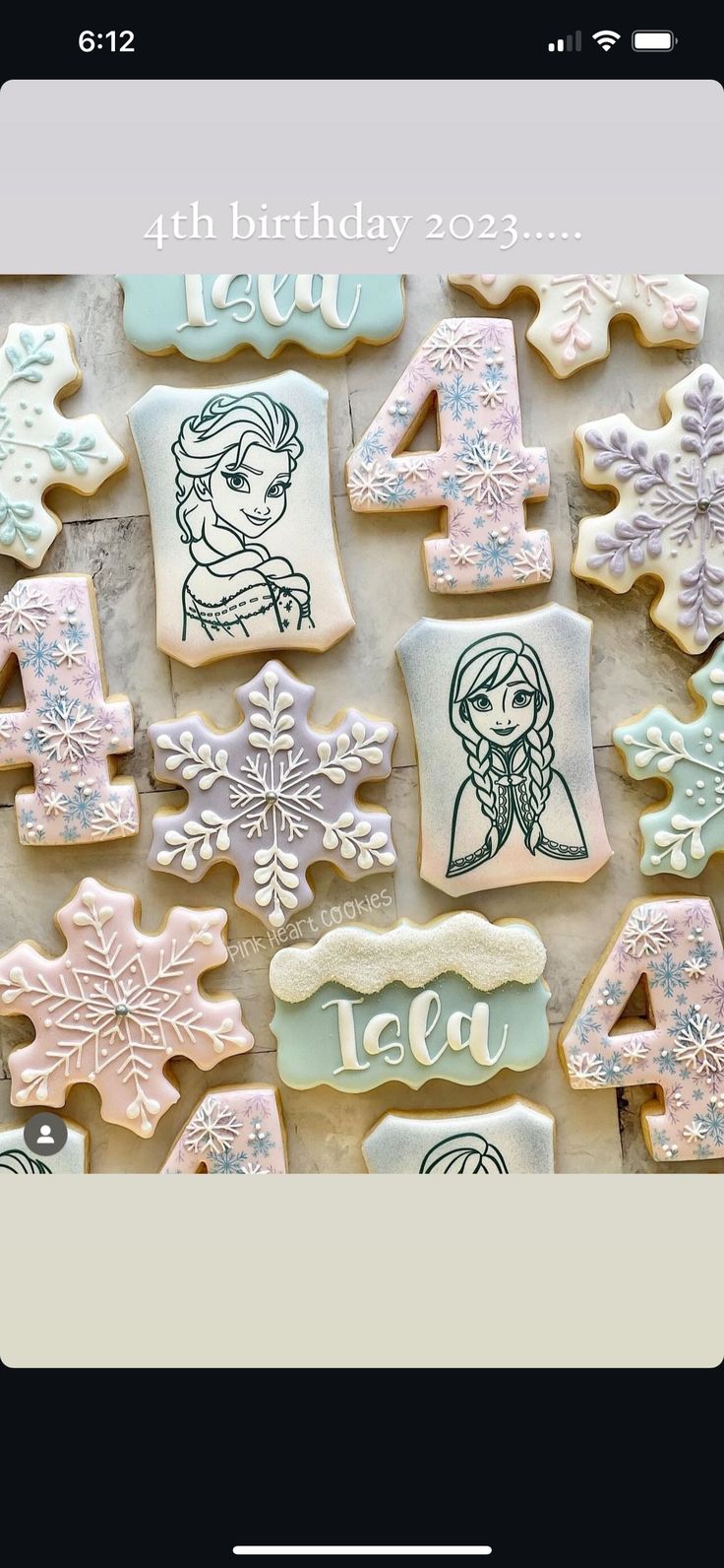 cookies decorated with frozen princesses and snowflakes are displayed on a phone screen