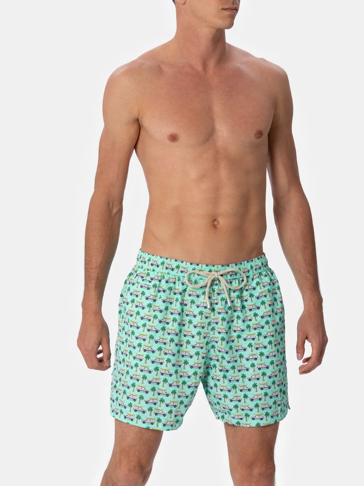 Man Lighting mid-length swim shorts are designed with a lightweight fabric that dries quickly, earning their name Lighting. The elasticized waistband and drawstring closure with branded terminals ensure a comfortable fit, while the branded eyelets are strategically placed to drain water and prevent the shorts from ballooning. Featuring side pockets with French seams and a back patch pocket with a magnetic closure, these swim shorts are both practical and stylish. Additionally, there's a small in Green Athleisure Swim Trunks For Swimming, Green Sporty Athletic Shorts For Poolside, Green Swim Trunks For Vacation Pool Time, Green Swimming Shorts For Vacation, Summer 4-way Stretch Swim Trunks For Water Sports, Green Swim Shorts For Vacation, Green Swim Trunks With Upf 50+ For Vacation, Green Pool Shorts For Vacation, Green Shorts For Pool Vacation