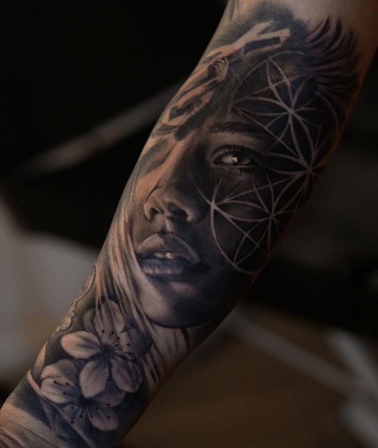 a woman's face with flowers and triangles on her arm, in black and grey