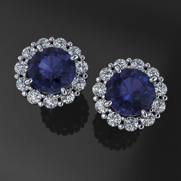 Simple. Sleek. Sexy dark blue lab grown sapphires surrounded by diamonds. These gorgeous earrings have two .5 carat lab grown sapphires each set in 14k gold settings, with nearly a half carat of diamonds to boot. Choose from 14k yellow, white or rose gold. Note: The photos are not exact, they are renders. The finished earrings will have the typical notched earring post, matching ear nuts, etc. [[----- GEMSTONE DETAILS -----]] Two 5mm round dark blue lab grown sapphires, .5 carat each. Twenty 1.6 Halo Diamond Earrings, Sapphire And Diamond Earrings, Halo Earrings, Blue Sapphire Diamond, Earring Post, Gold Halo, Big Earrings, Small Earrings, Gorgeous Earrings