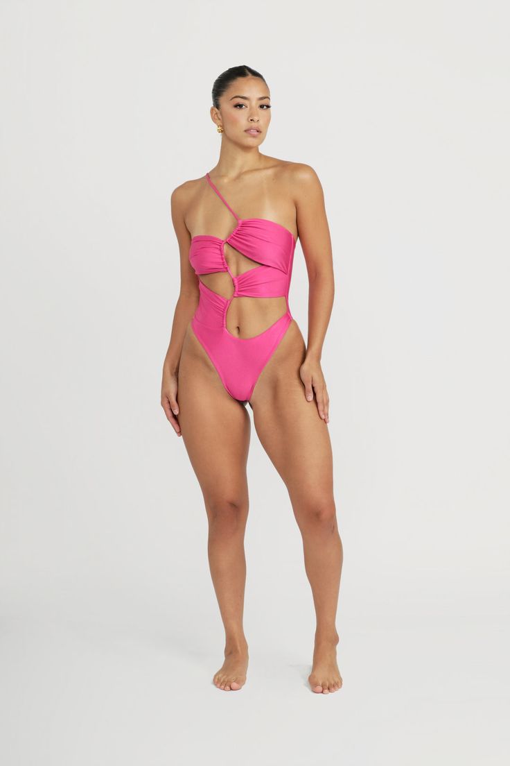 Looking for a swimsuit that will have all eyes on you? Look no further than the Biscayne one-piece! With high-leg cuts and strategically placed cutouts, this suit is the perfect balance of sexy and playful. Show off just the right amount of skin and make a splash this summer! Model wears a size XS. Model stats - Bust:33 Waist:26 Hips:36 Hot Pink Swimsuit, Deodorant Stains, Swimsuits Bikinis, Pink Swimsuit, High Leg, All About Eyes, This Summer, Show Off, Hot Pink