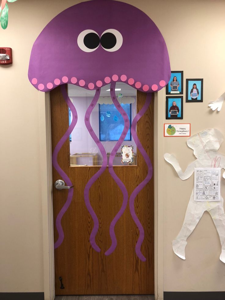 a door decorated to look like a jellyfish with paper cutouts on the front