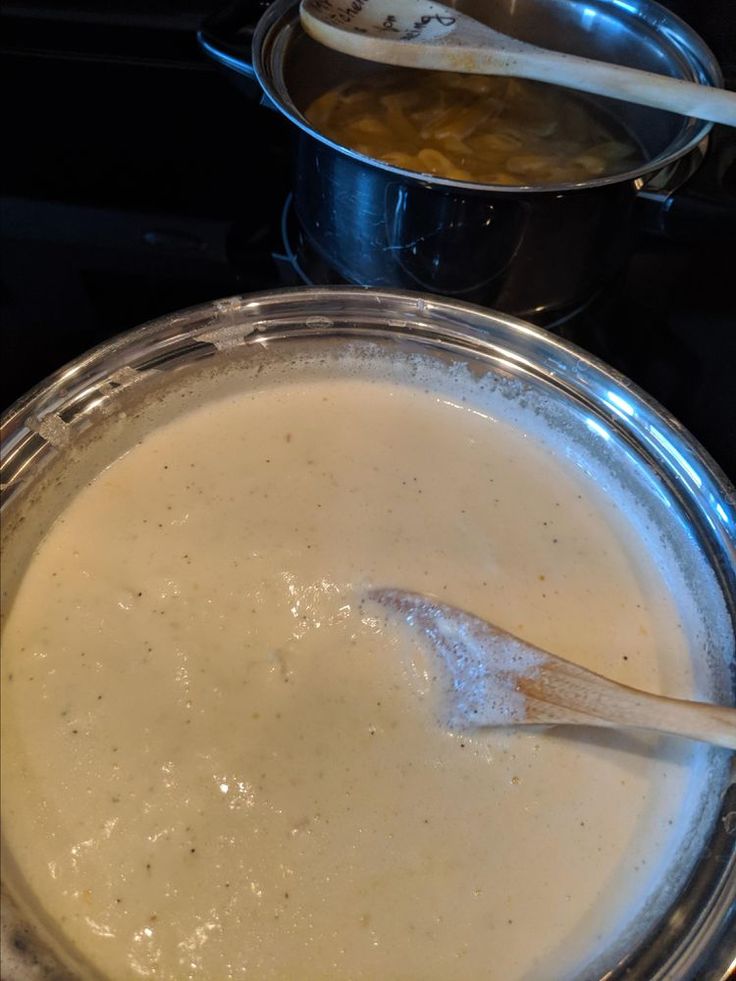 there is a pot and pan on the stove with some food in it that has been cooked