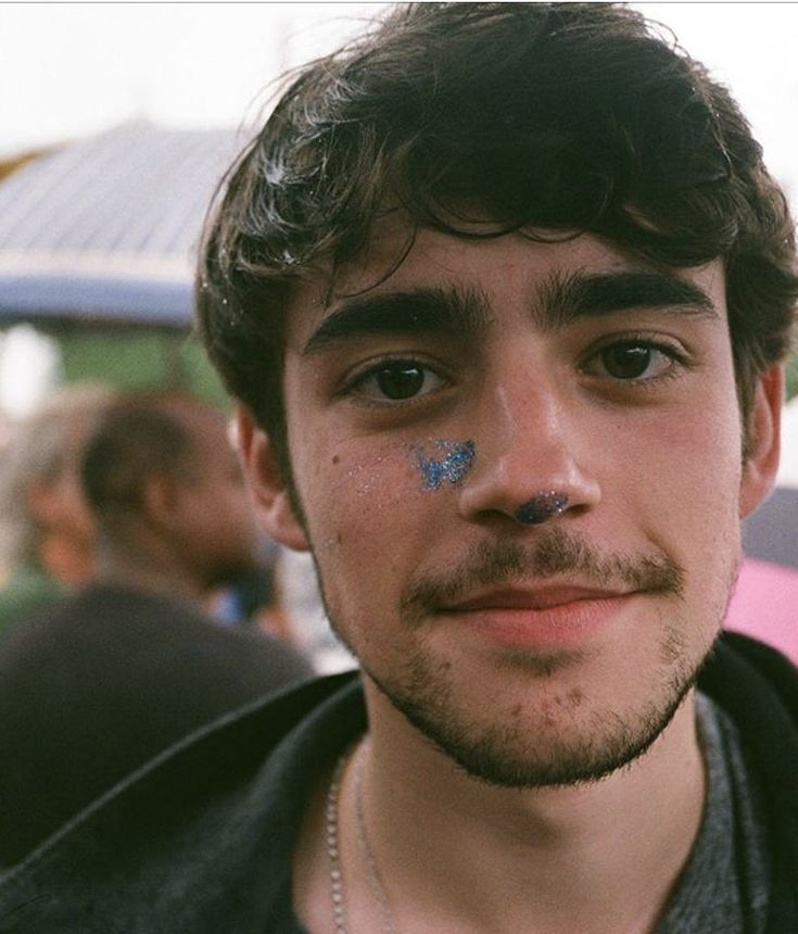 a man with blue paint on his face