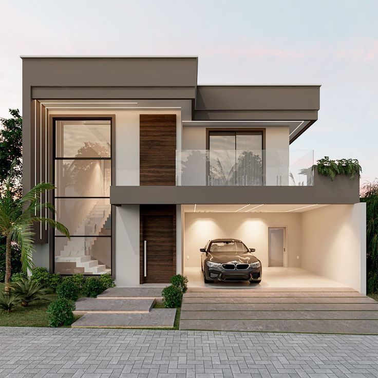 a car is parked in front of a modern house