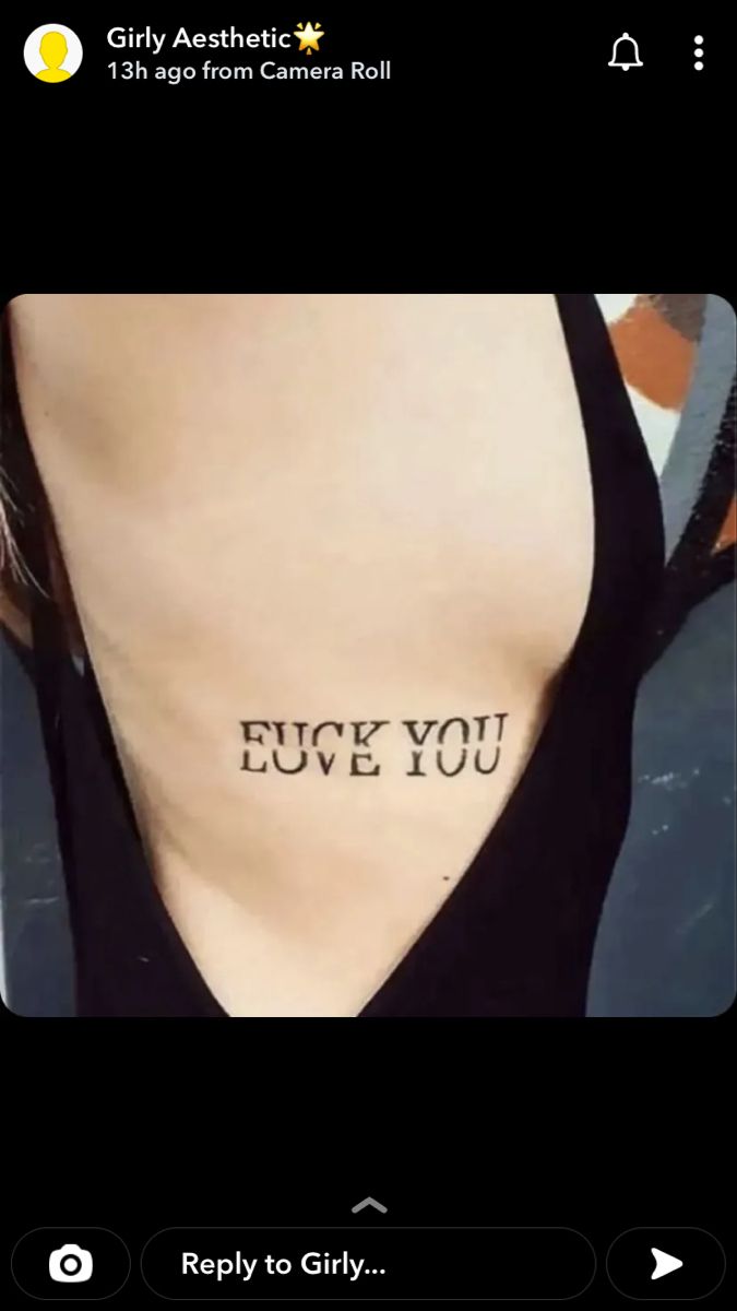 the back of a woman's neck with an inscription on it that says, i love