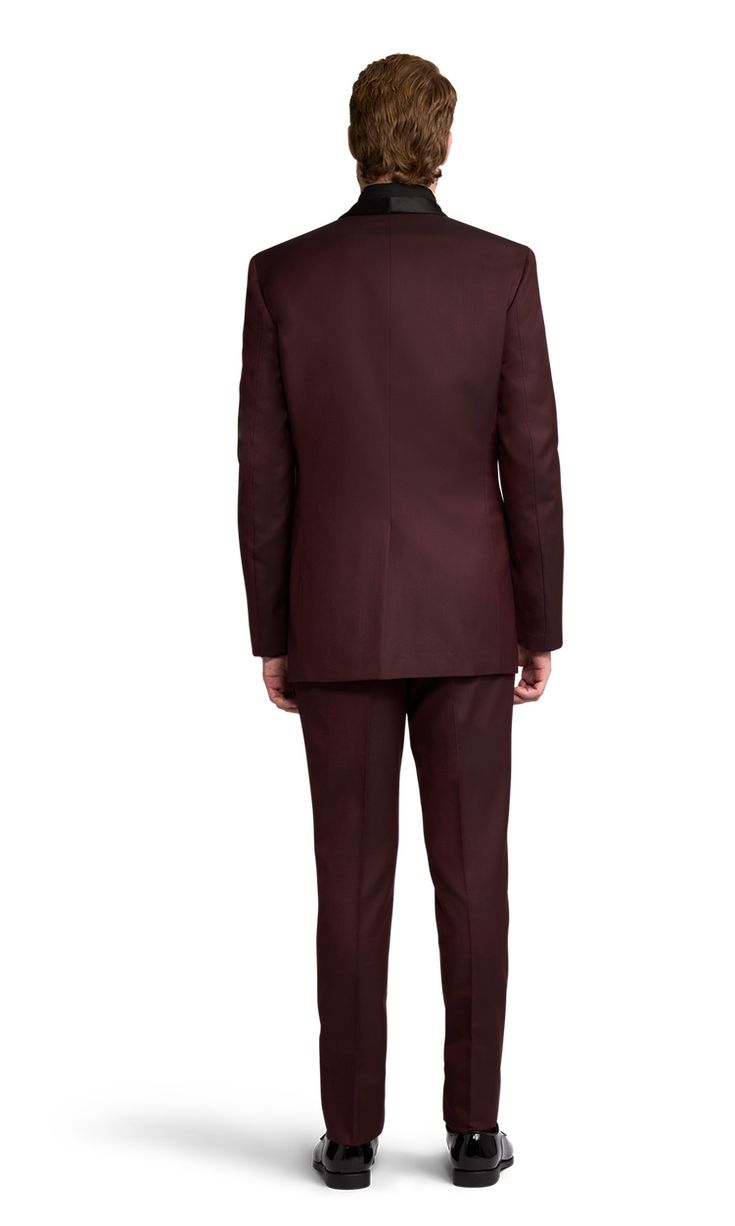 A slim burgundy tuxedo with one button and a shawl lapel. Tailored Burgundy Tuxedo For Business, Burgundy Tailored Tuxedo For Formal Occasions, Burgundy Tailored Tuxedo For Business, Tailored Burgundy Business Tuxedo, Burgundy Single Breasted Suit With Suit Collar, Burgundy Single-breasted Suit With Suit Collar, Burgundy Fitted Tuxedo For Business, Fitted Burgundy Tuxedo For Business, Burgundy Single-breasted Suit For Formal Occasions