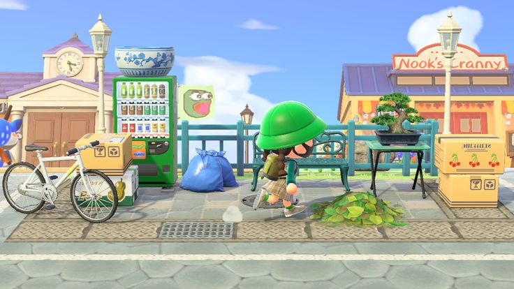 an animal crossing the street in front of a store with many bikes and other items