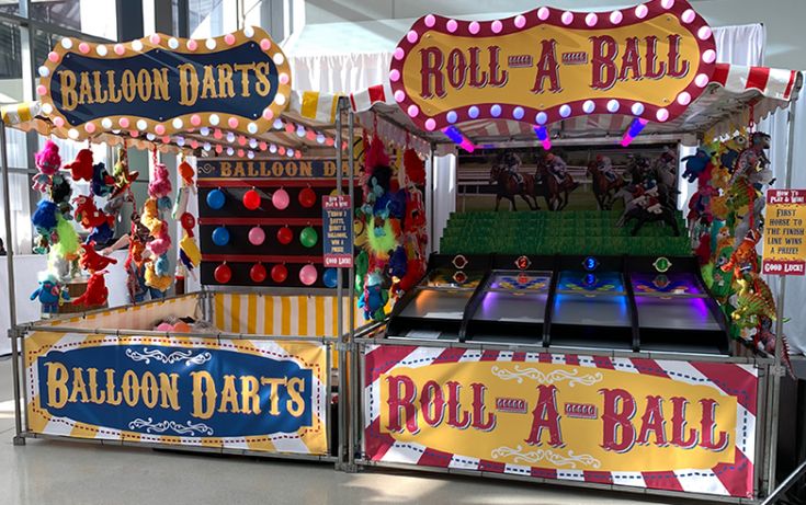 an old fashioned carnival game with balls and a ball table