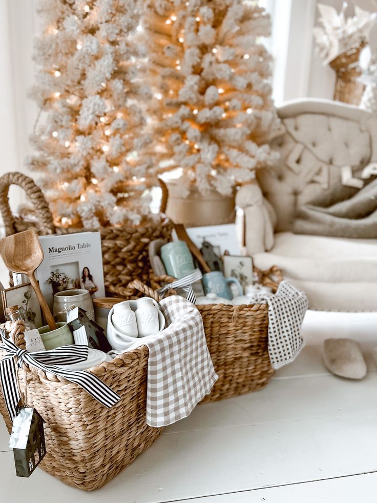 a basket filled with items next to a christmas tree