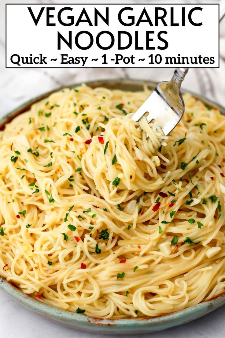 a fork full of vegan garlic noodles in a bowl with the title above it