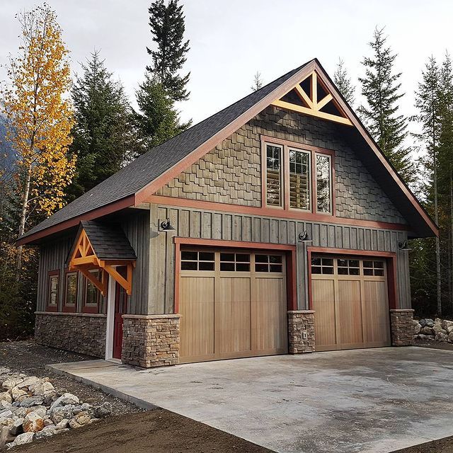 a two car garage is shown in front of some trees