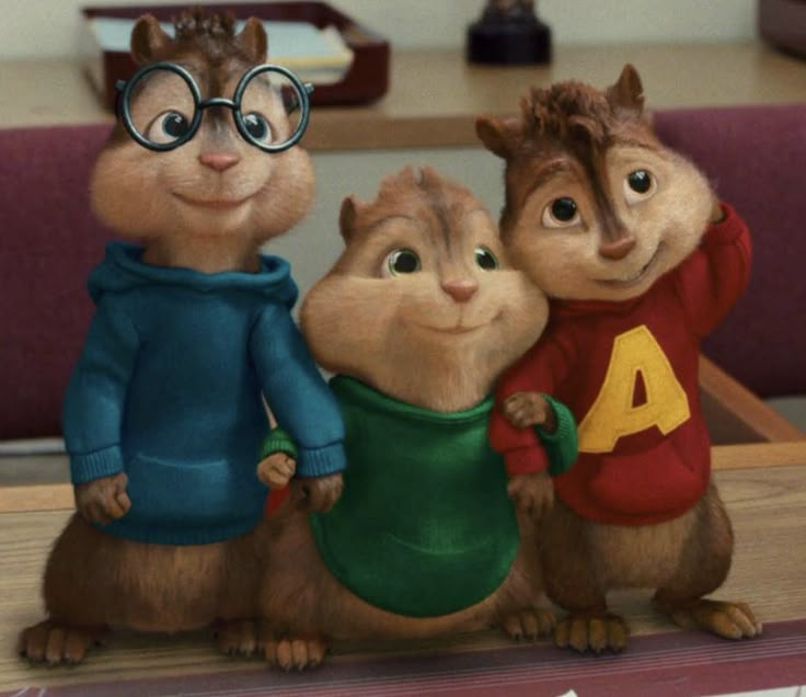 three cartoon chipmuns standing next to each other