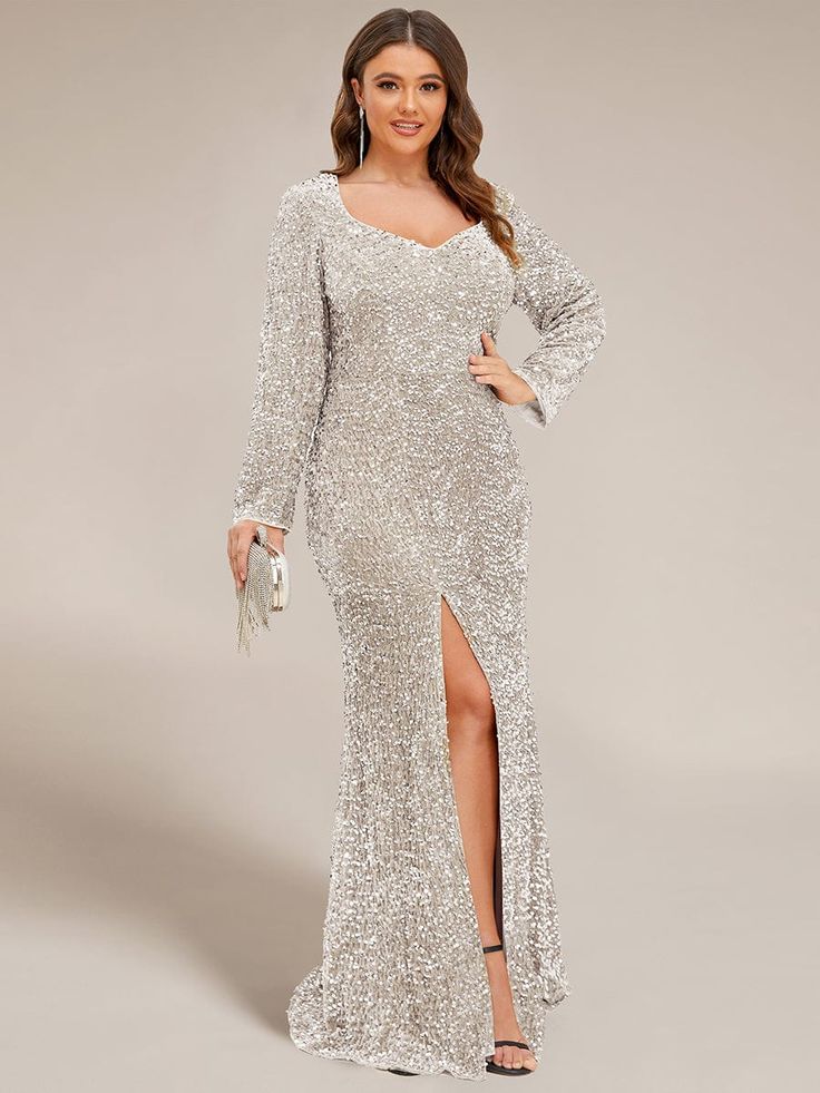 Sparkling sequins cover this show-stopping front slit evening dress. Fitted long sleeves and a plunging sweetheart neckline with darts on the front complement a stunning bodycon floor-length silhouette, making this glamorous evening dress a show-stopping style worthy of your next formal event or special occasion. Fit: Please refer to size chart. Length: Floor length. Sleeve Style: Long sleeves. Closure: It is concealed a zipper up the back. Undergarments: It is not padded, with lining. Fabric:The garment comprises sequin. Stretch: Fabric is high stretch. Occasion:Red Carpet Dress, Mother of the Bride Dress, Premiere Dress, Vintage Sequin Dress, Wedding, Banquet. Plus Size Evening Gown Special Occasions, Sondra Celli, Asymetrical Dress, Dancesport Dresses, Western Gown, Glamorous Evening Dresses, Wedding Koozies, Bodycon Evening Dress, Umgee Dress