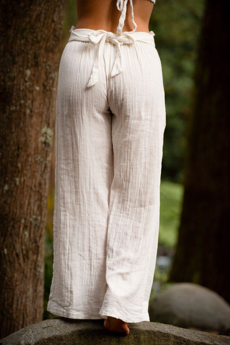 The Ocean Pants are made with a super soft and cosy linen fabric, feature two pockets and a belt tie for adjustable fitting. Beautifully worn as high waist pants or hipster style, these earthy pants are light and breezy, perfect for yoga and summer days. MEASUREMENTS: Waist with Elastic: 74cm/ 29.13 inch Leg length: 104cm/ 40.94 inch Hip to groin: 24cm/ 9.44 inch Hand made with Love ❀ Relaxed Fit Wide-leg Harem Pants For The Beach, Wide-leg Linen Harem Pants For Beach, Linen Ankle-length Harem Pants For Beach, Non-stretch Hippie Beach Pants, Bohemian Wide-leg Beach Pants, Belt Tying, Hipster Fashion, Summer Days, High Waisted Pants