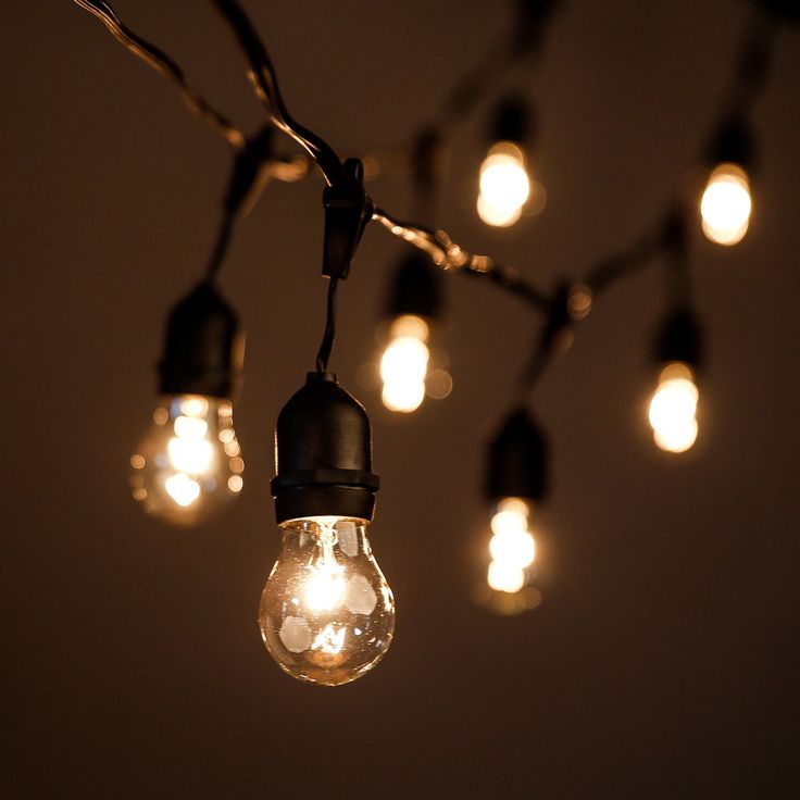 a bunch of light bulbs hanging from a wire