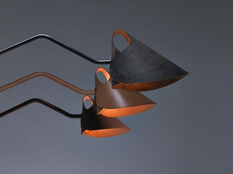 two lamps that are hanging in the air