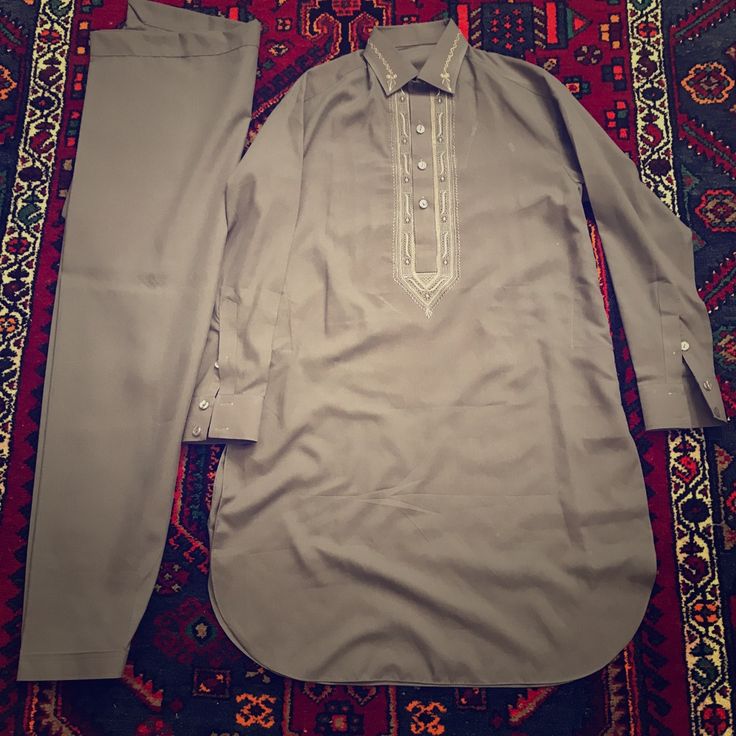 Brand New, Never Worn, 2 Piece Men's Outfit. The Color Is A Purplish-Grey. Has A Nice Embroidered Collar And Chest. Also Has Two Pockets. Chest Is 21in And Length Is 37in. Has Some White Marks On Shirt, Should Come Out If Washed. Made In Afghanistan Fitted Cotton Traditional Wear For Semi-formal Occasions, Fitted Cotton Semi-formal Traditional Wear, Gray Traditional Wear For Eid, Traditional Gray Wear For Eid, Semi-formal Cotton Traditional Wear, Traditional Gray Kurta For Eid, Gray Fitted Kurta For Eid, Fitted Gray Kurta For Eid, Traditional Cotton Semi-formal Sets