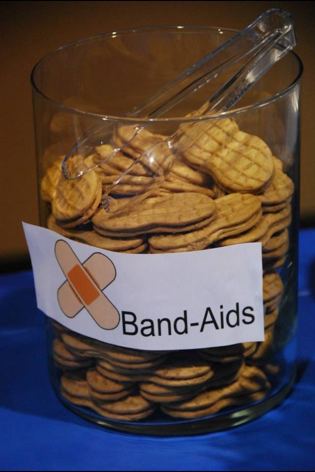 a glass jar filled with cookies on top of a blue table