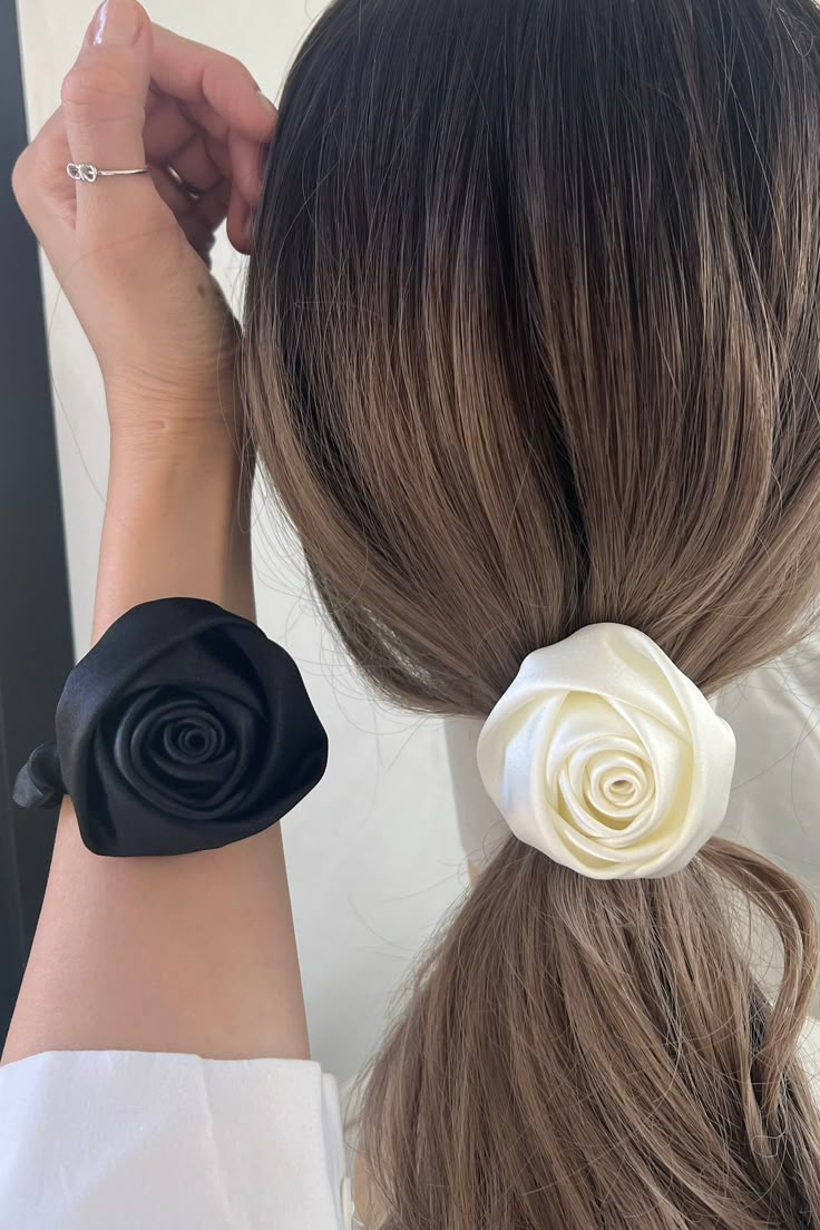 Add a luxurious touch to your hairdo with this 3D Rose Flower Mono Thin Satin Hair Scrunch Tie. Crafted from ultra-soft satin, it is adorned with a delicate 3D rose flower for a romantic look. The thin design is perfect for securing even the finest of hair styles, making it a must-have for your beauty regimen. Specification Material: Satin Fabric Color: Ivory / Black Dimensions: 2.5inch Made by : South KoreaShip From : Los Angeles (U.S) Elegant Satin Bow Hair Accessories Gift, Silk Flower Hair Accessories, Satin Flower Hair Clips, Girls Accesories, Minimalist Hair Accessories, Pink Satin Scrunchie, Diy Hair Scrunchies, Diy Hair Accessories Ribbon, Rose Hair Clip