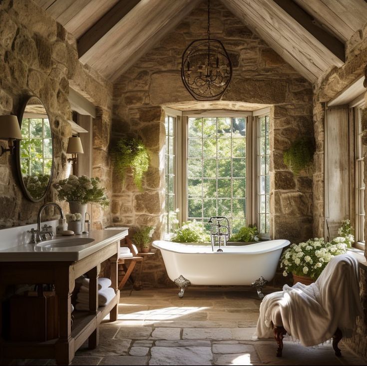 an old fashioned bathroom with stone walls and exposed ceiling, large tub in the center